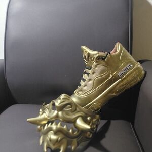 Gold Art Sculpture with Mask Design